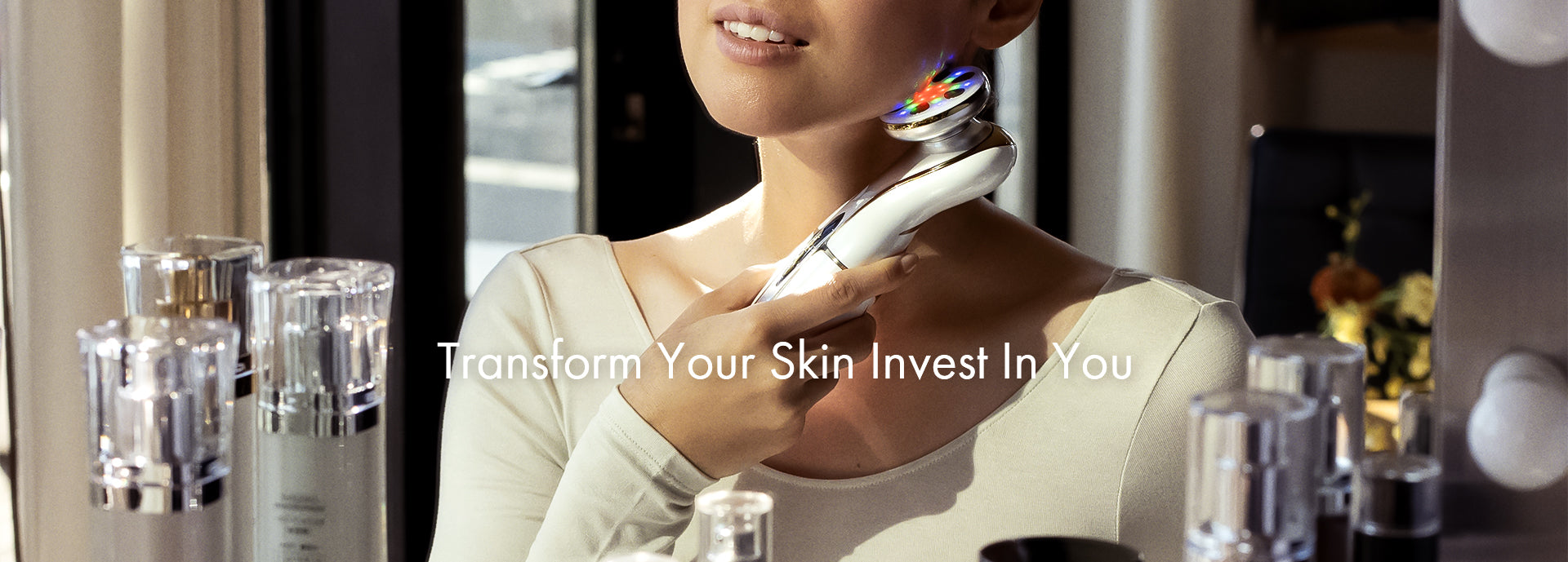 Close-up of a woman using CHOUCHOU TOKYO The Morpho beauty device with LED lights clearly illuminated, highlighting its advanced skincare technology during use.