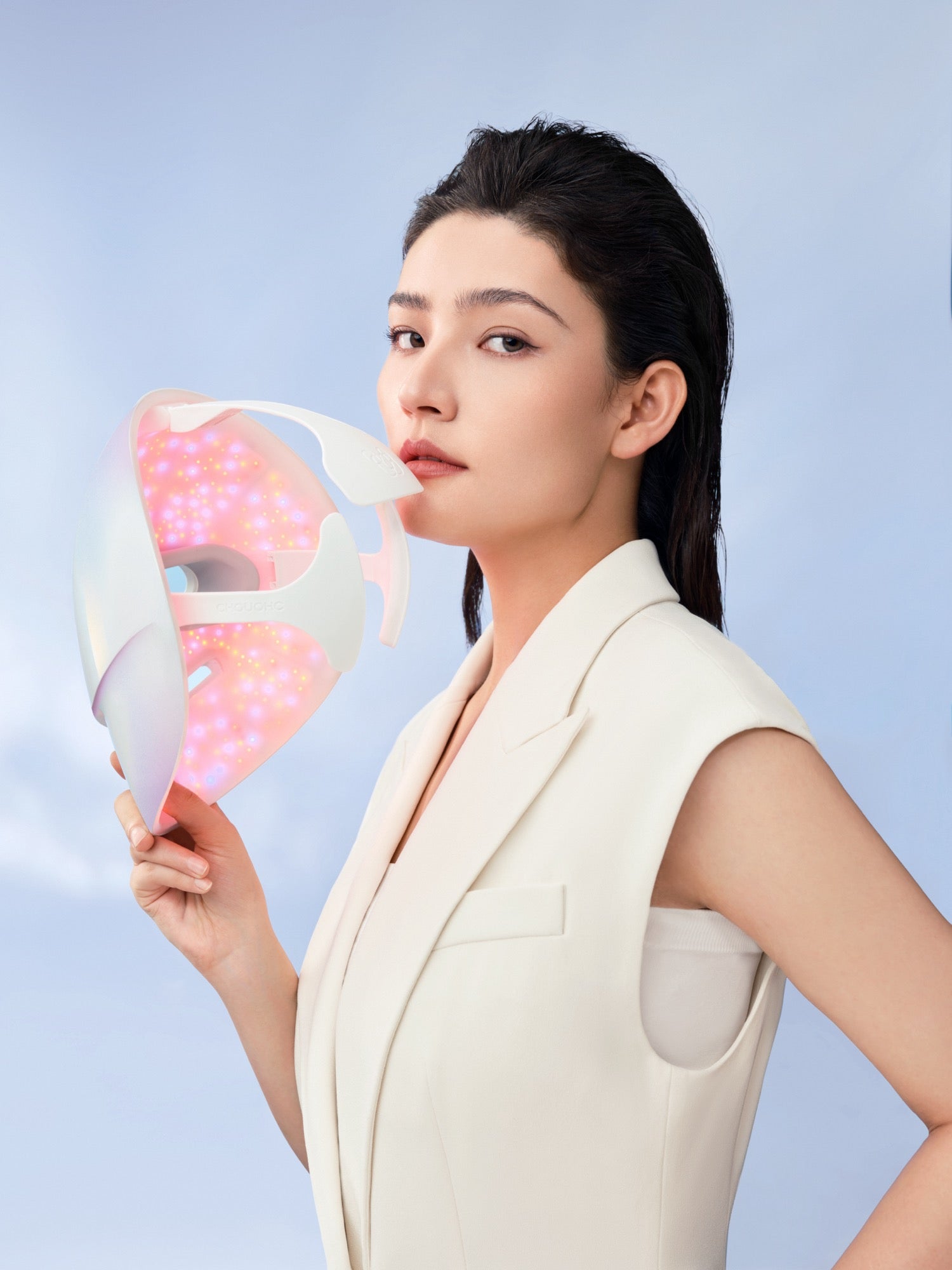 Model holding The Radiance Kit showing LED light panel